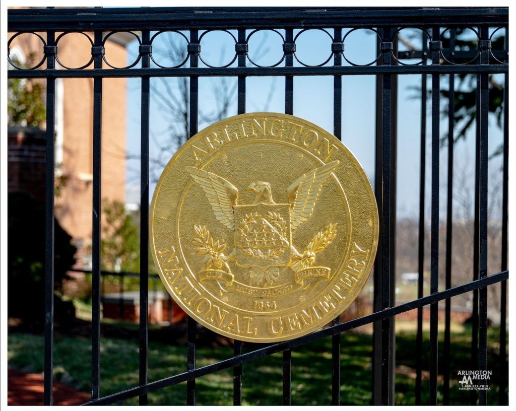 The Arlington National Cemetery symbol on the gate between Fort Myer ...